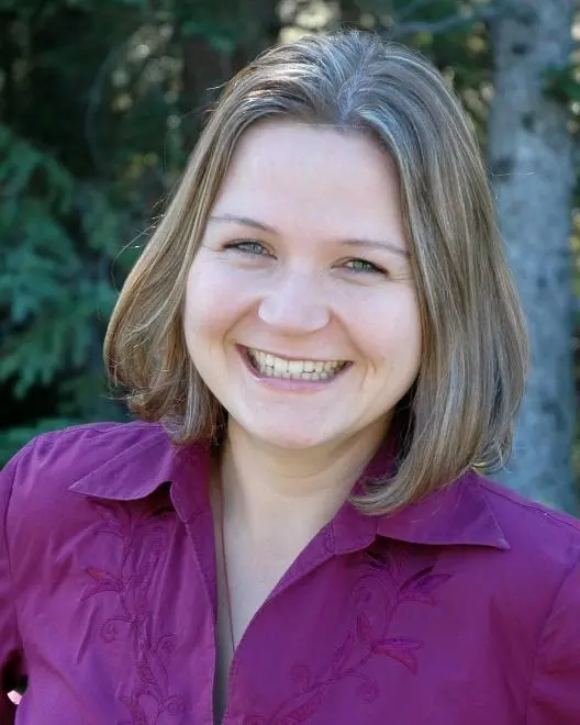 Dr. Dorothy Roginska, chiropractor, smiling outdoors